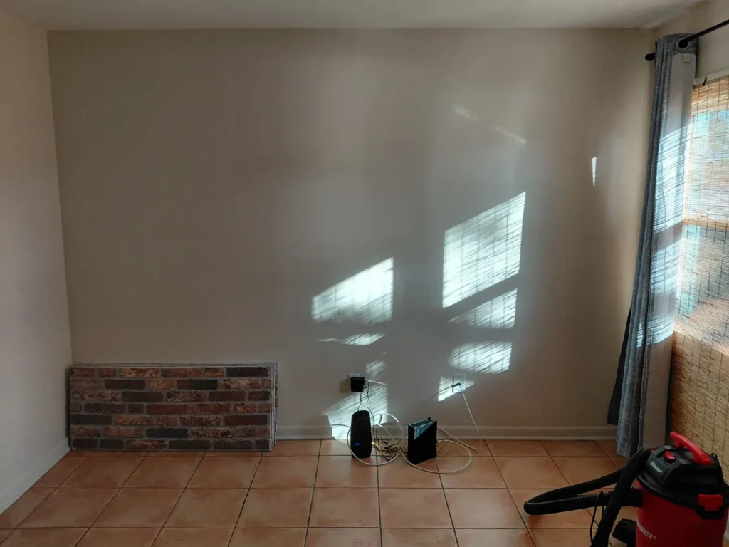 Decorative brick wall panel installation with TV cable concealment in Ocala Florida