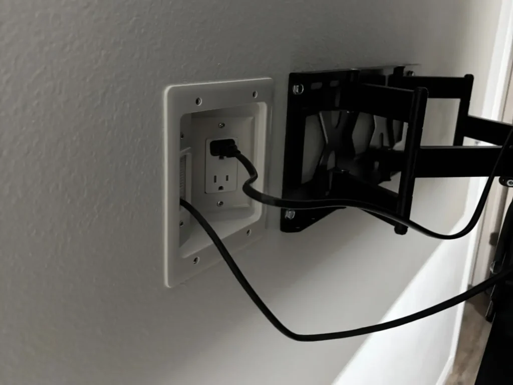 In wall power outlet and cable concealment for TV installation in Ocala Florida