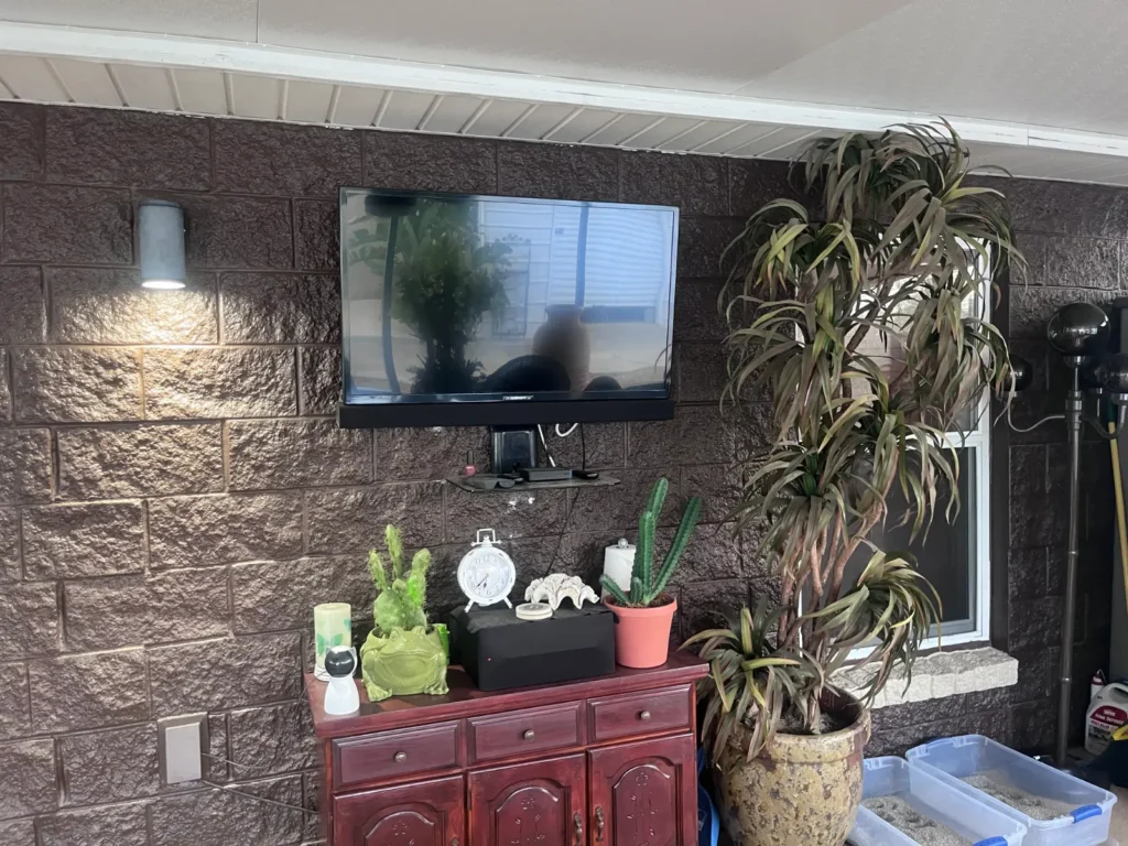 Outdoor TV mount installation on covered patio in Ocala Florida