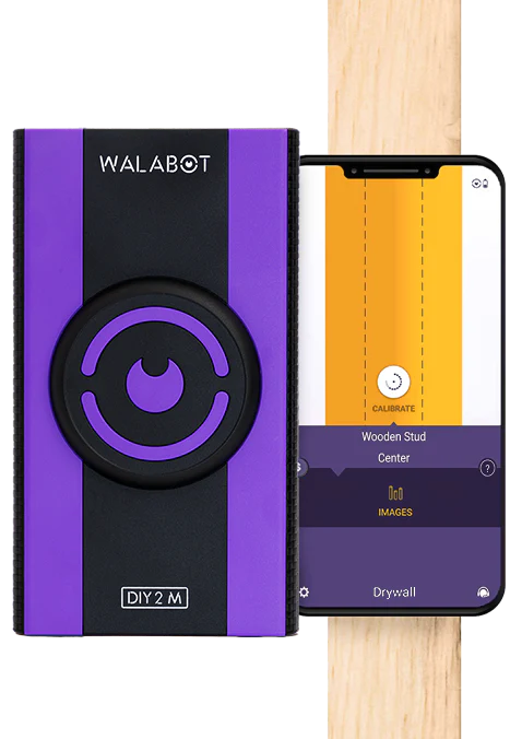 Professional wall scanning tool used to locate studs before TV mount installation in Ocala Florida