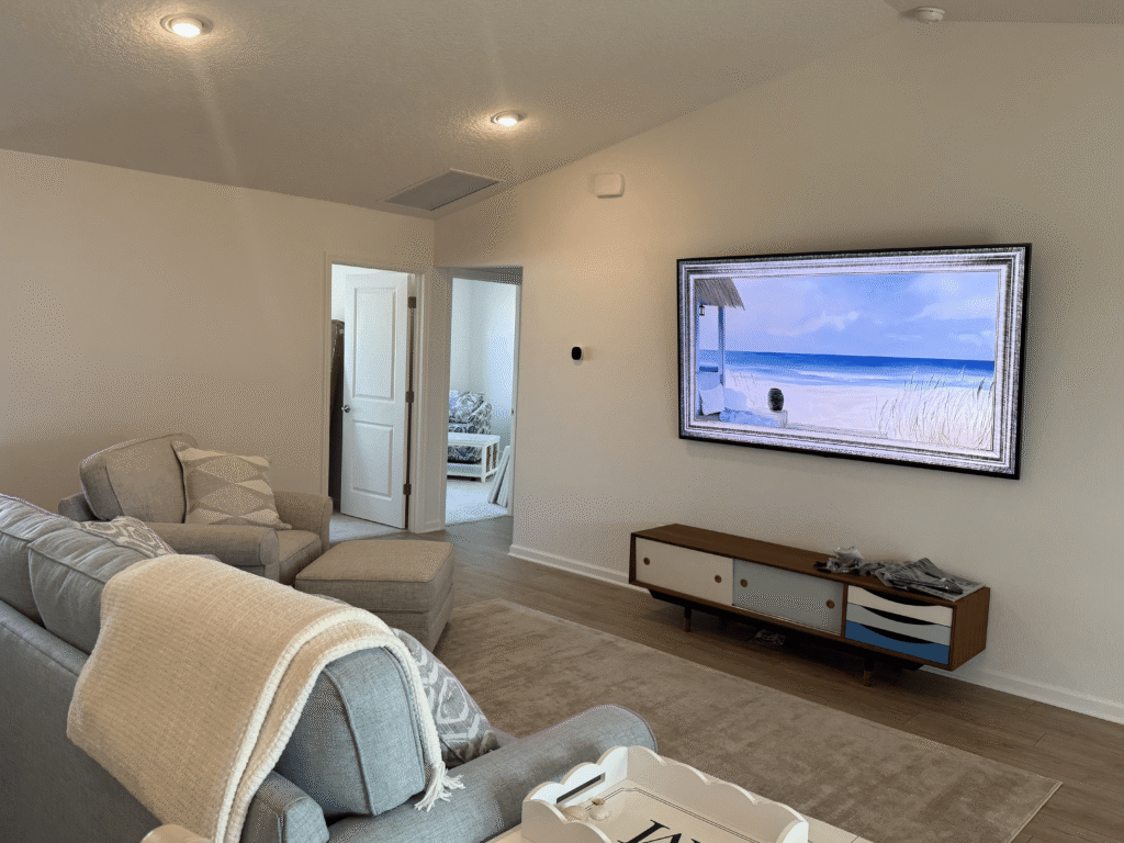 Samsung Frame TV wall mount installation in living room with clean modern finish in The Villages Florida