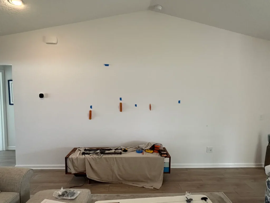 Measuring wall layout before TV mount installation in Belleview Florida