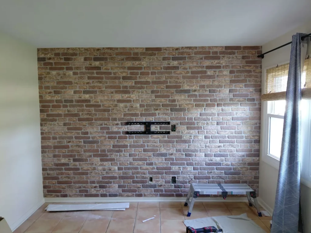 TV wall mount bracket installed on brick accent wall ready for TV installation in Ocala Florida