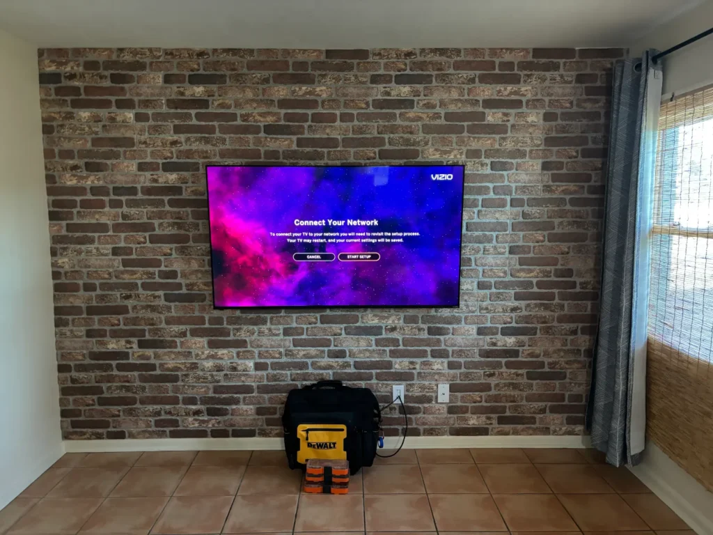 TV wall mount installation on brick accent wall in Dunnellon Florida