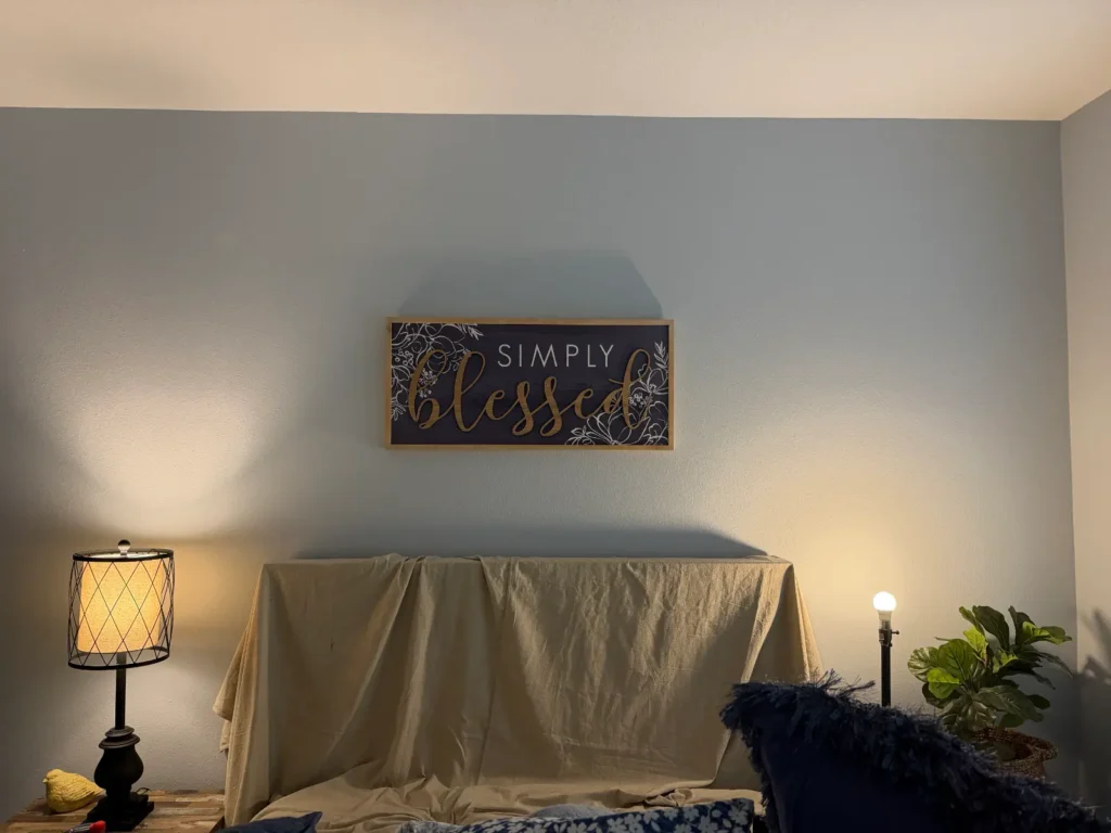 Simply Blessed wall sign professionally mounted above bedroom wall in Ocala Florida