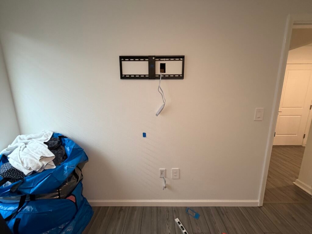 In-wall TV cable concealment installation in The Villages, Florida with hidden power and HDMI wiring.