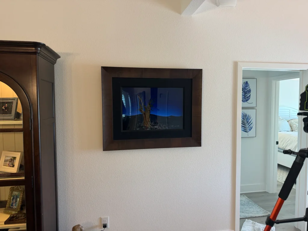 Decorative artwork professionally installed on an outdoor lanai wall using precision laser leveling in Ocala, Florida.