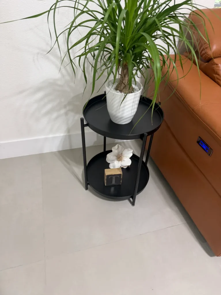 Finished black round side table professionally assembled in Ocala Florida